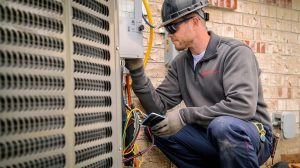 HVAC technician performing heat pump repair in Lewisburg, OH to restore heating during winter