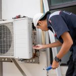 Fast and Reliable Air Conditioner Repair in Lewisburg, OH, for Hot Days HVAC technician performing air conditioner repair on outdoor AC unit to restore cooling performance